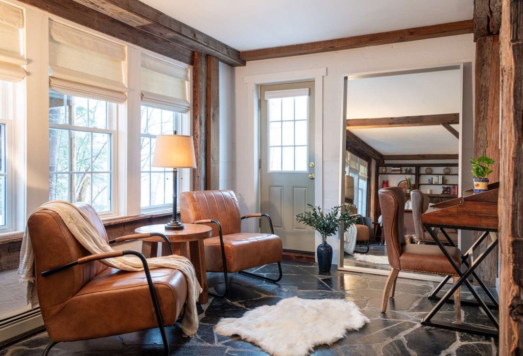 Sitting area with Two leather chairs and Desk