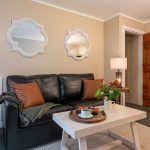 Leather Couch and coffee table in Premium 1 Queen Room