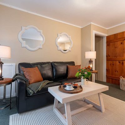 Leather Couch and coffee table in Premium 1 Queen Room