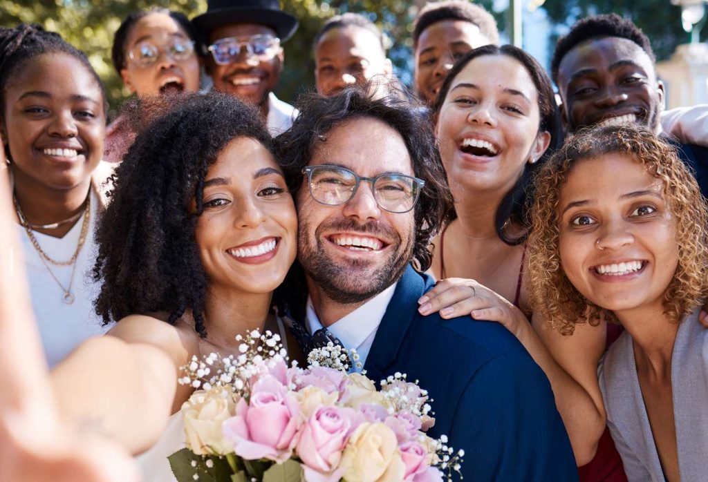 Wedding group gathering with the bide and groom for a selfie in Vermont